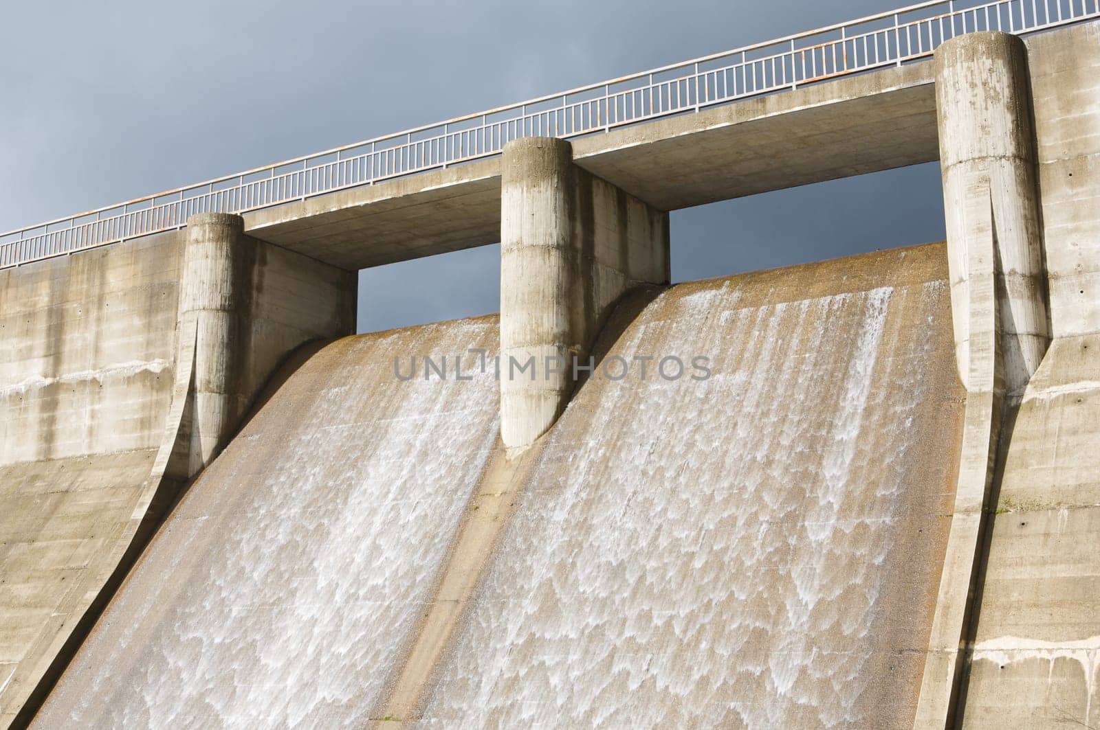 Dam water to generate energy