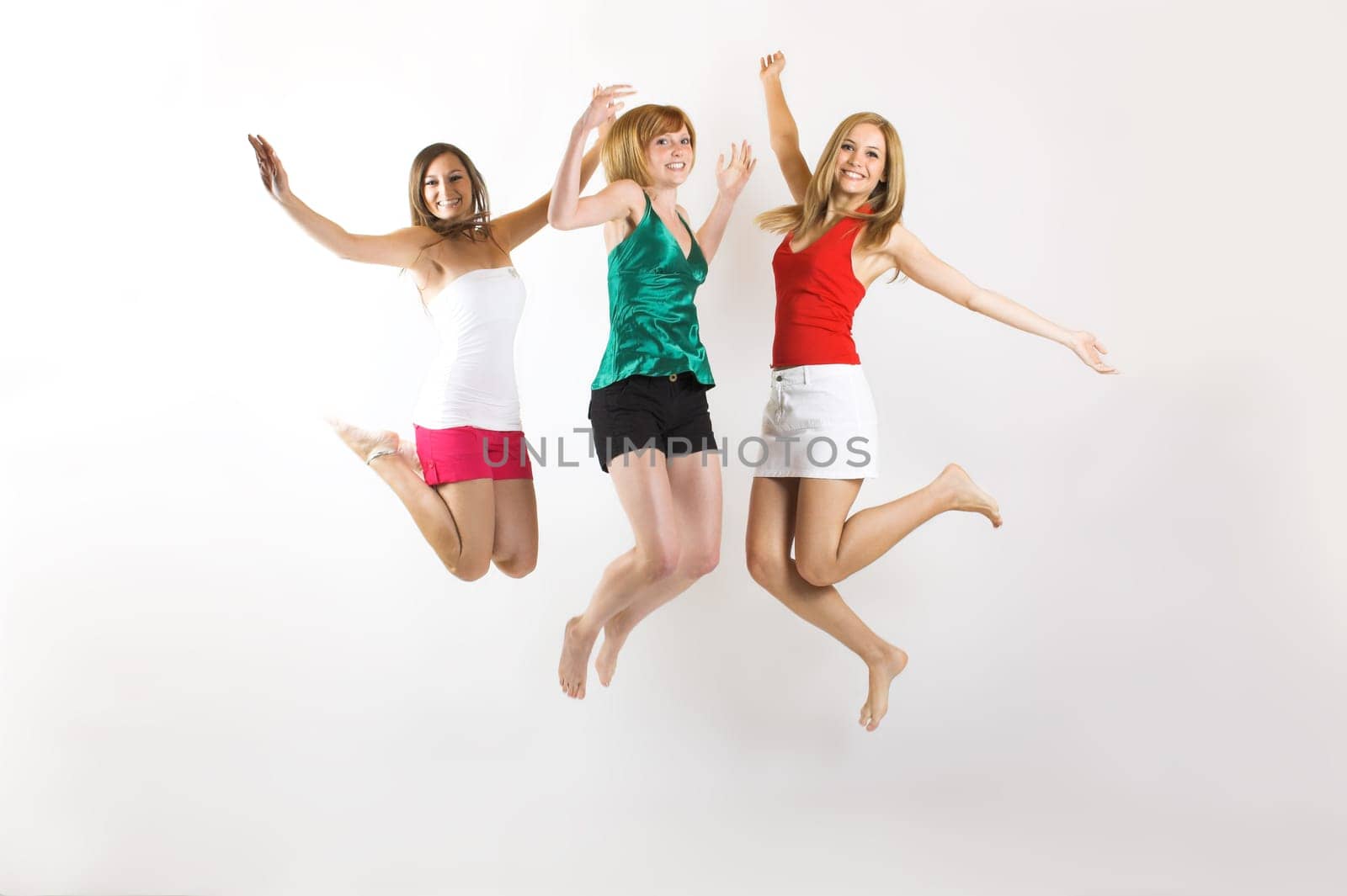 three young woman jumping