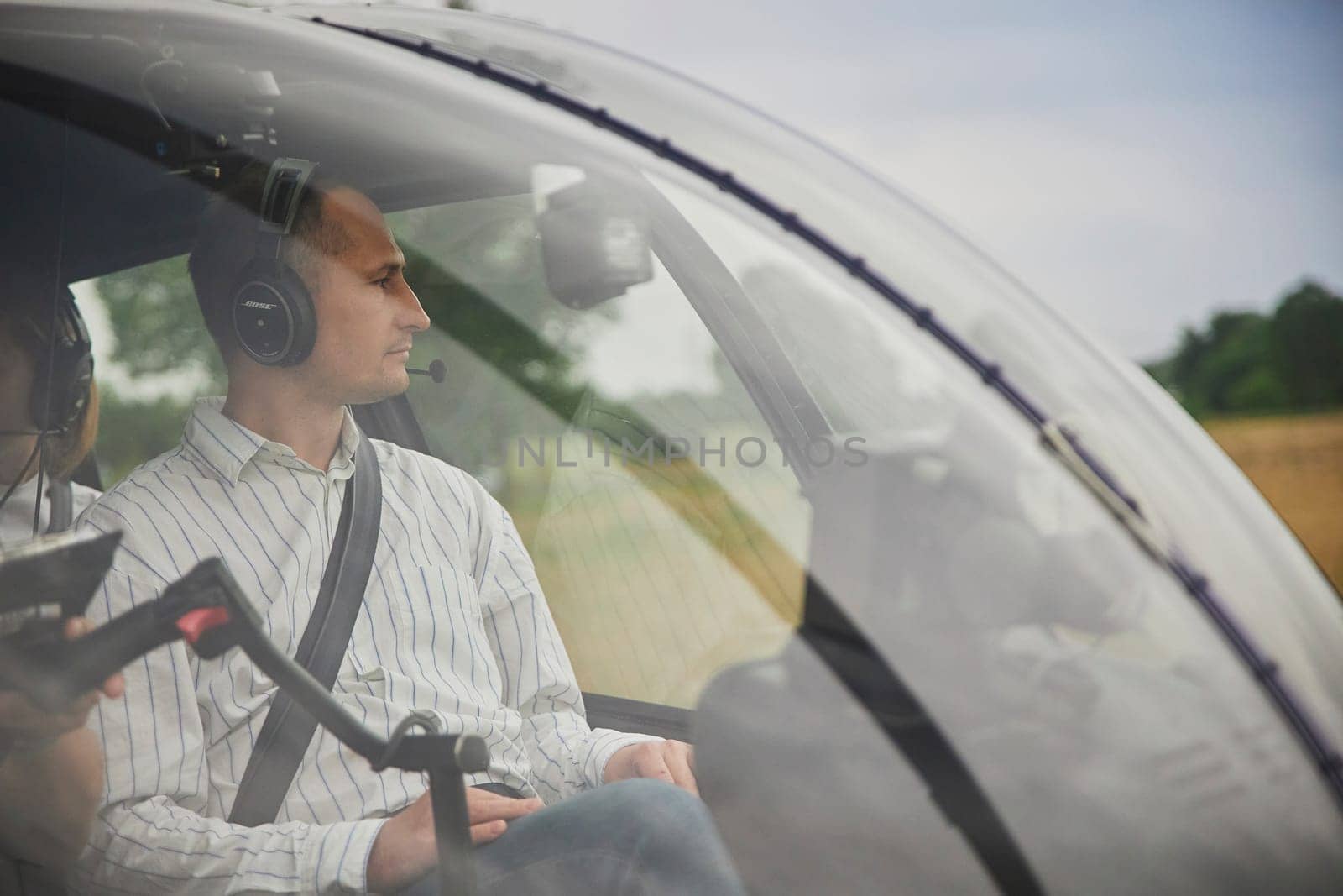 Taastrup, Denmark, 11th August 2023: Man in the cockpit of a helicopter close-up