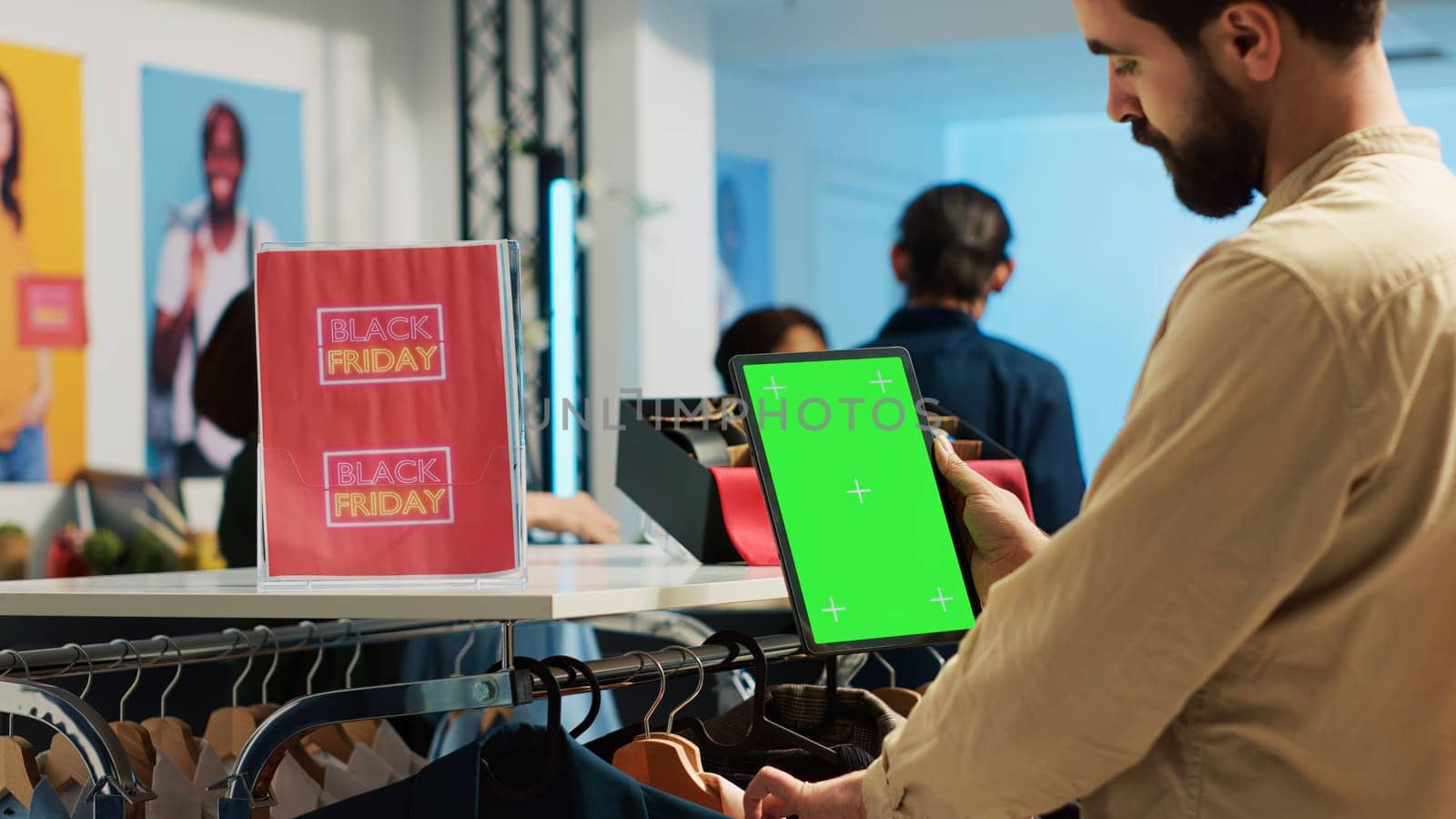 Shopper using greenscreen on tablet by DCStudio