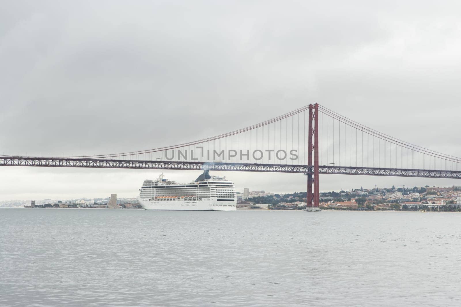 Huge cruise ship passes along the river under the bridge in cloudy weather by Studia72