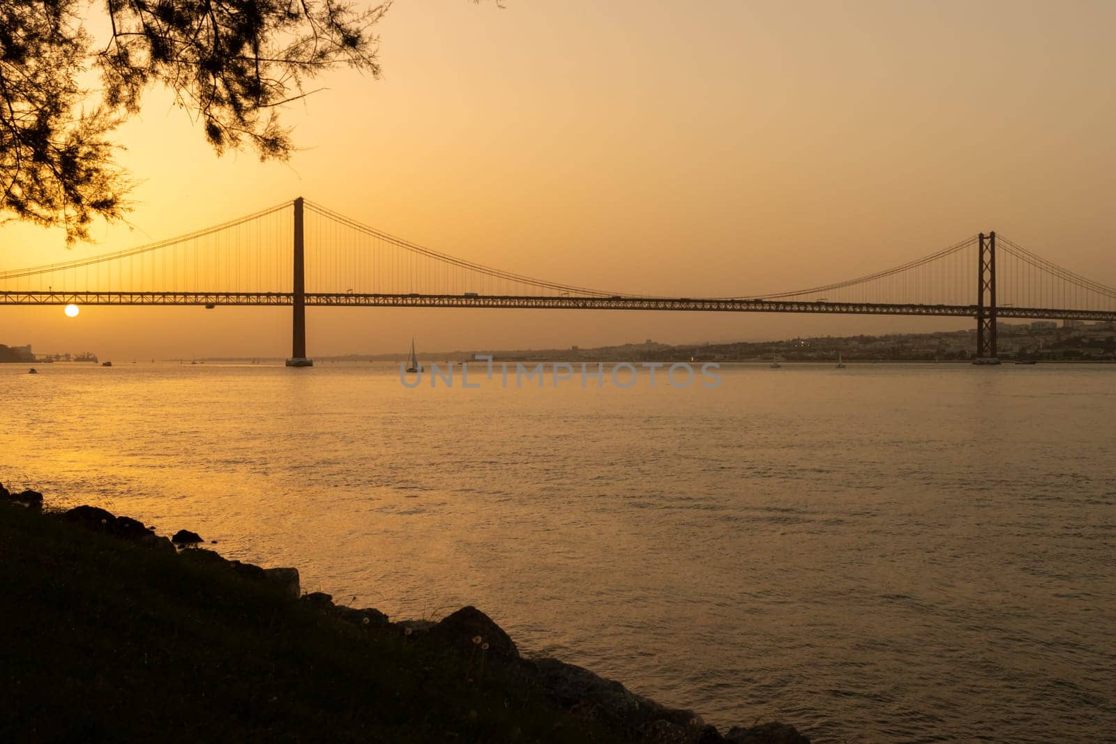 25th of April Bridge - Sunset over Tejo river in Lisbon by Studia72