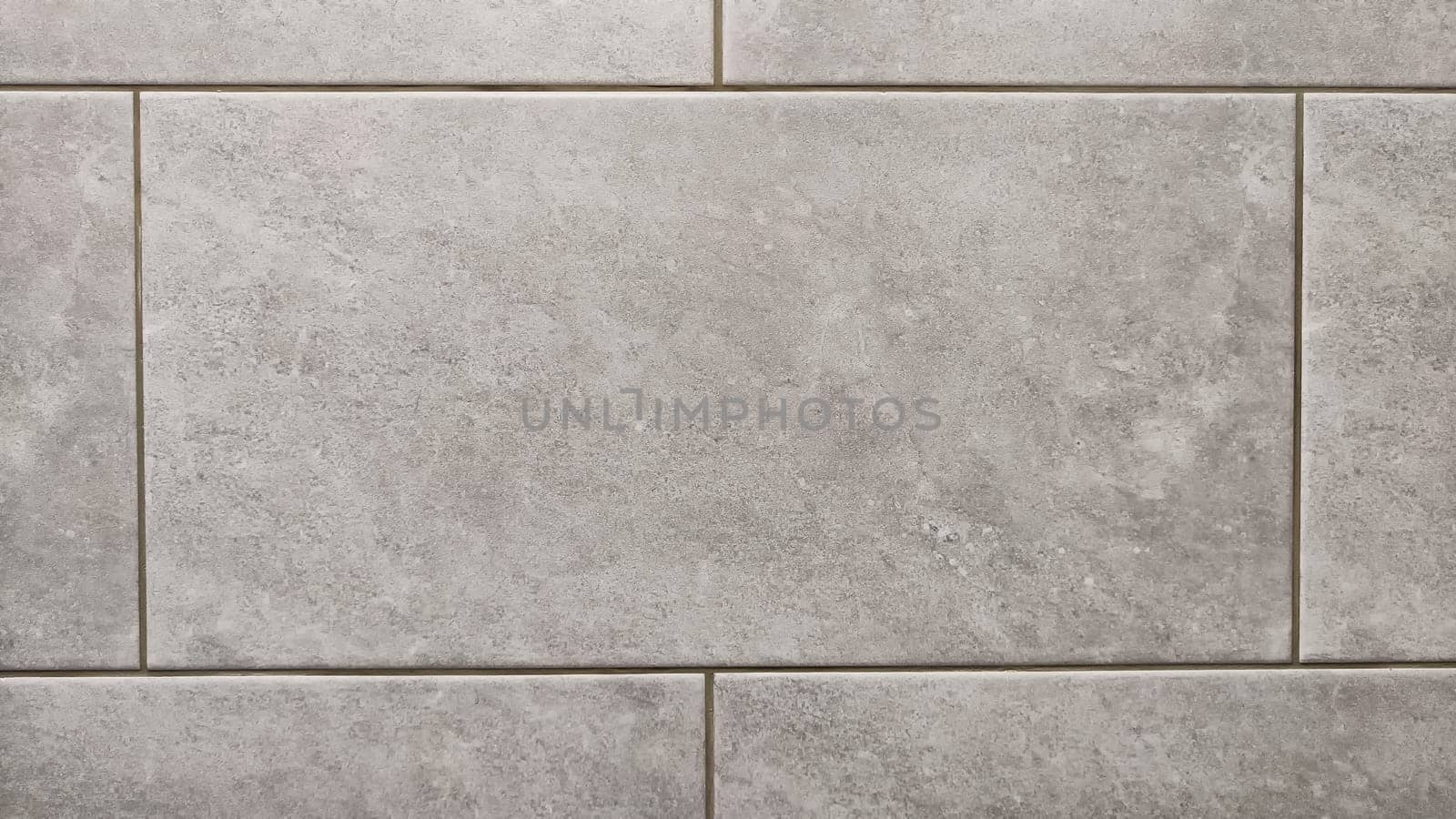 Rows and lines of square sidewalk gray tiles on floor outside or indoors. Abstract background, texture, pattern, frame, space for text and copy space