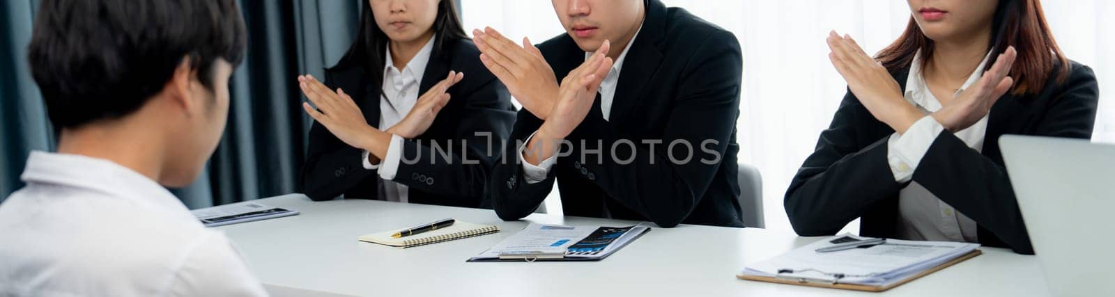 Candidate is rejected by job interviewer and human resources manager showing concept of unemployment, fired, disagreement and turning down the offer putting sadness on hiring person. Oratory failure.