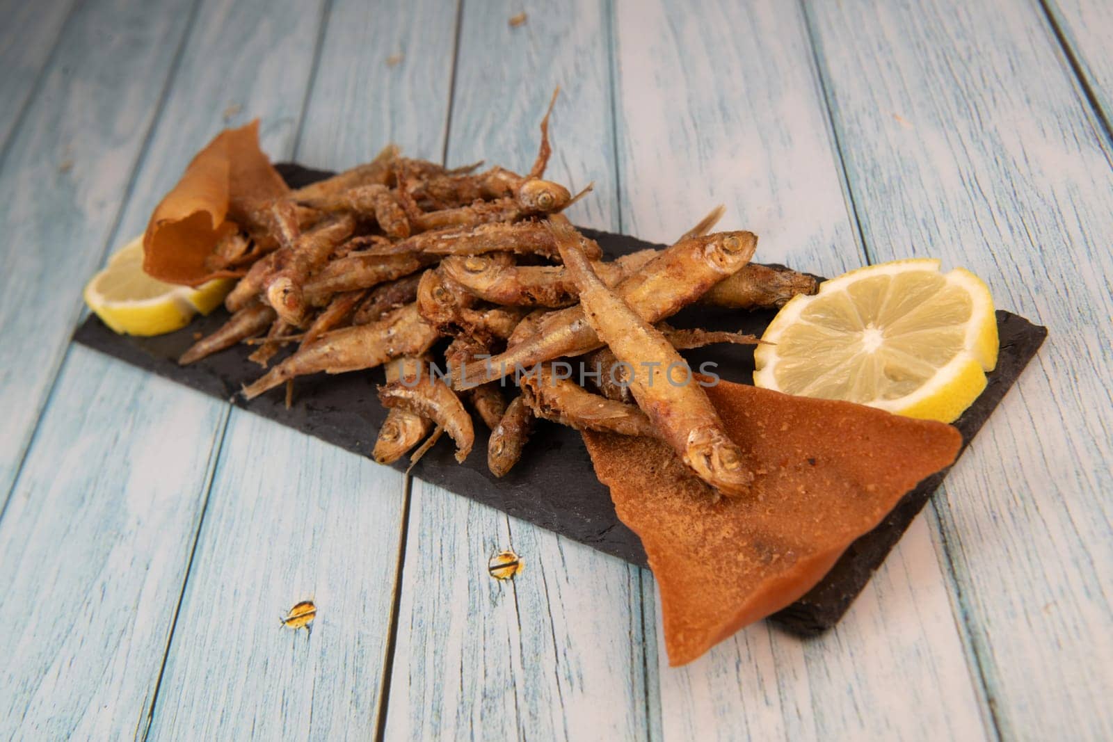 DEEP FRIED SEEFOOD, RECIPE FOR FISH, Smelt AND FRIED PITA, LEMON. High quality photo