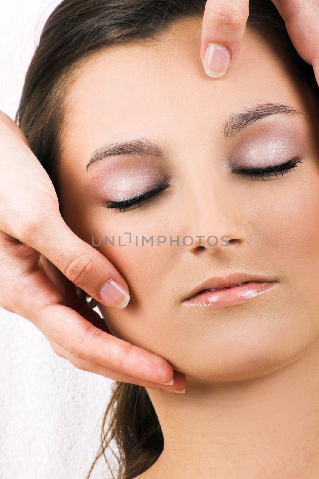 Relaxed woman having a head massage