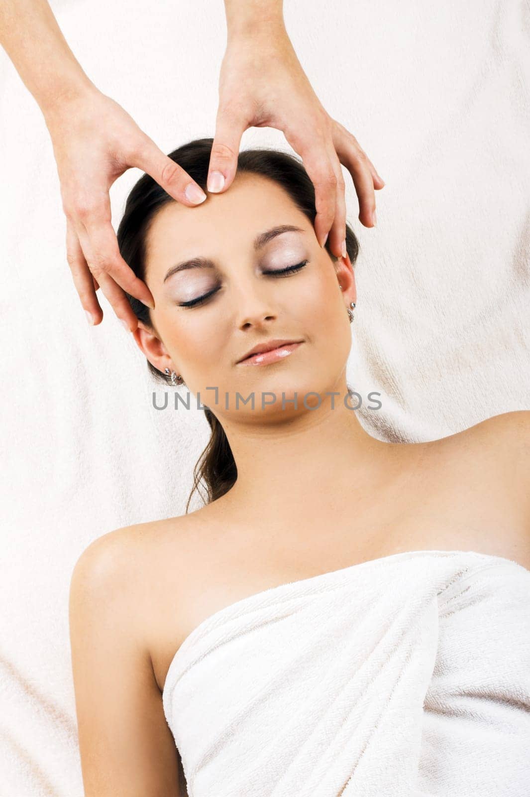 Relaxed woman having a head massage