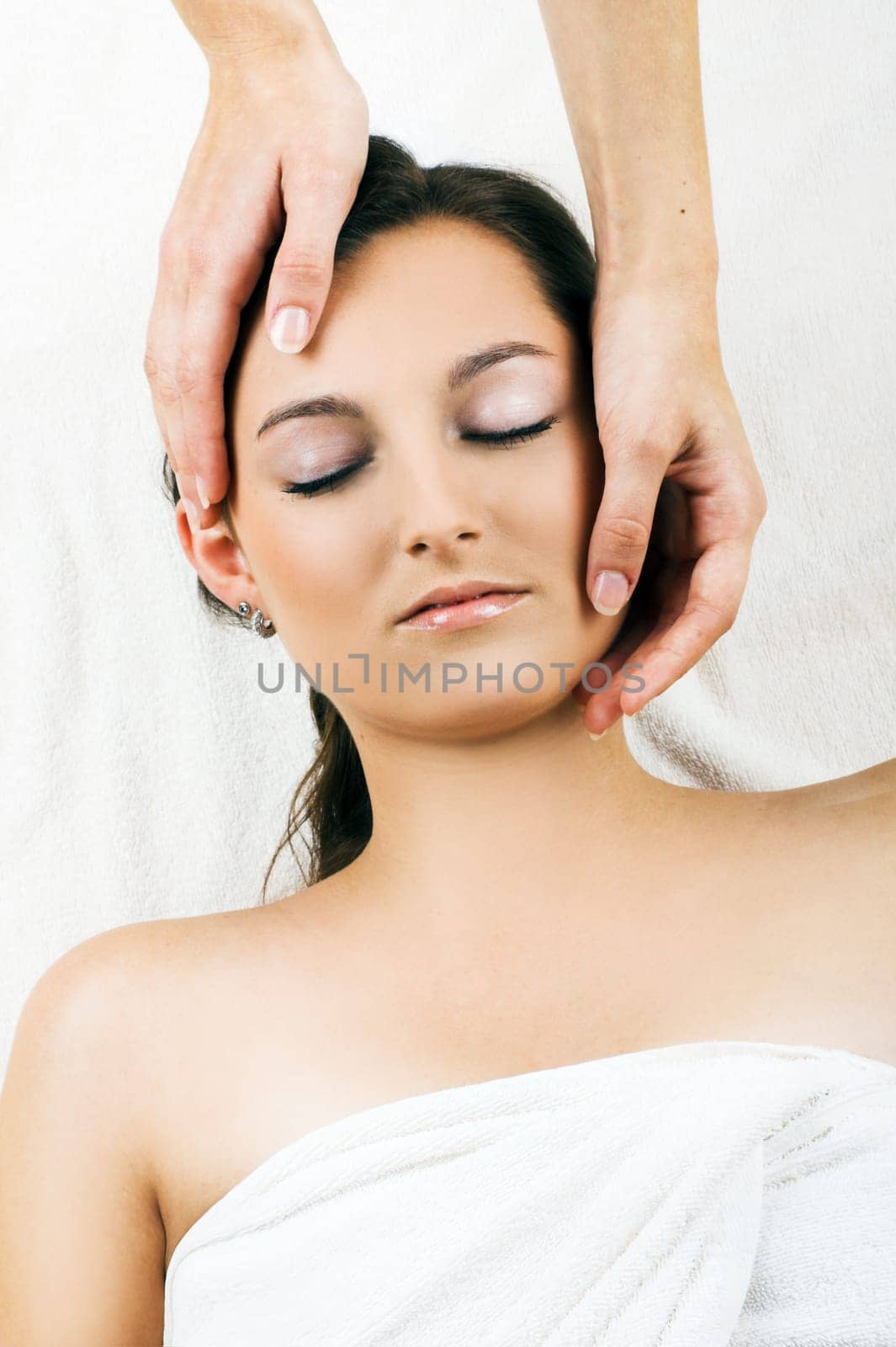 Relaxed woman having a head massage