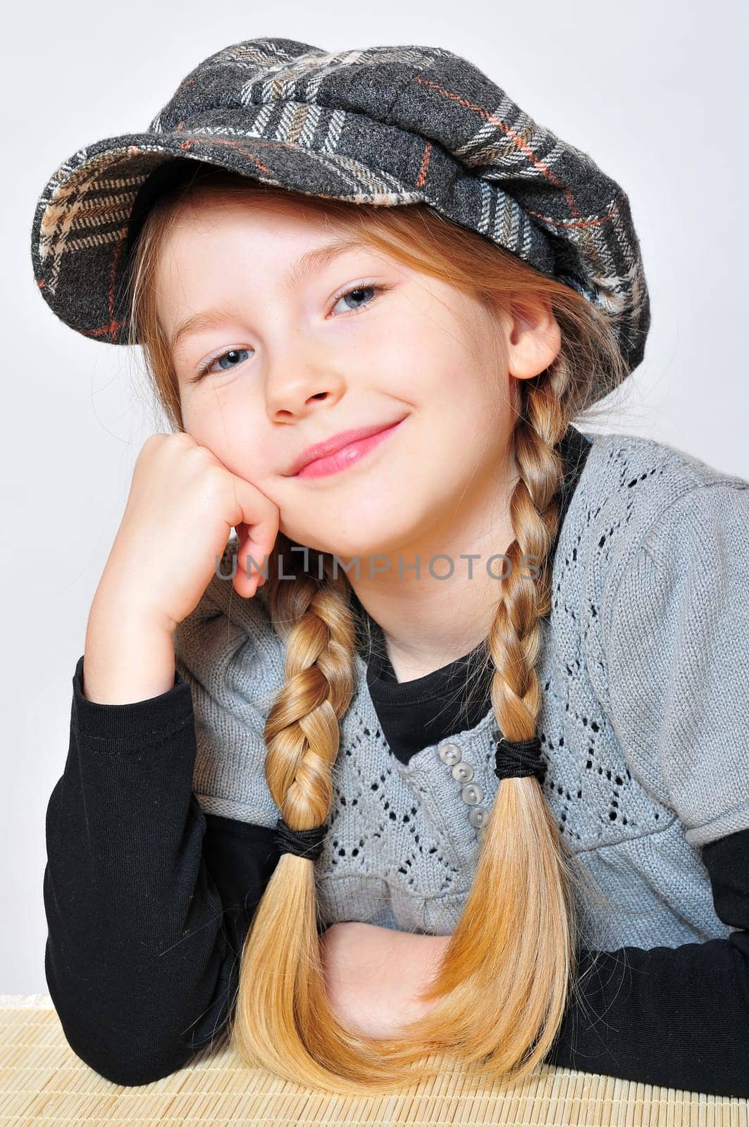 Girl with hat pigtails