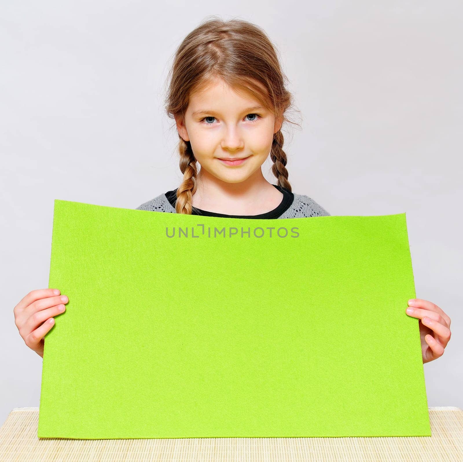 Girl holding sign