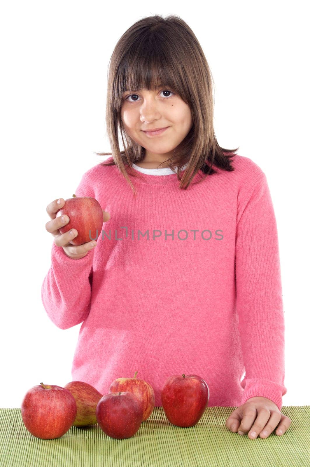 Adorable girl with red apples