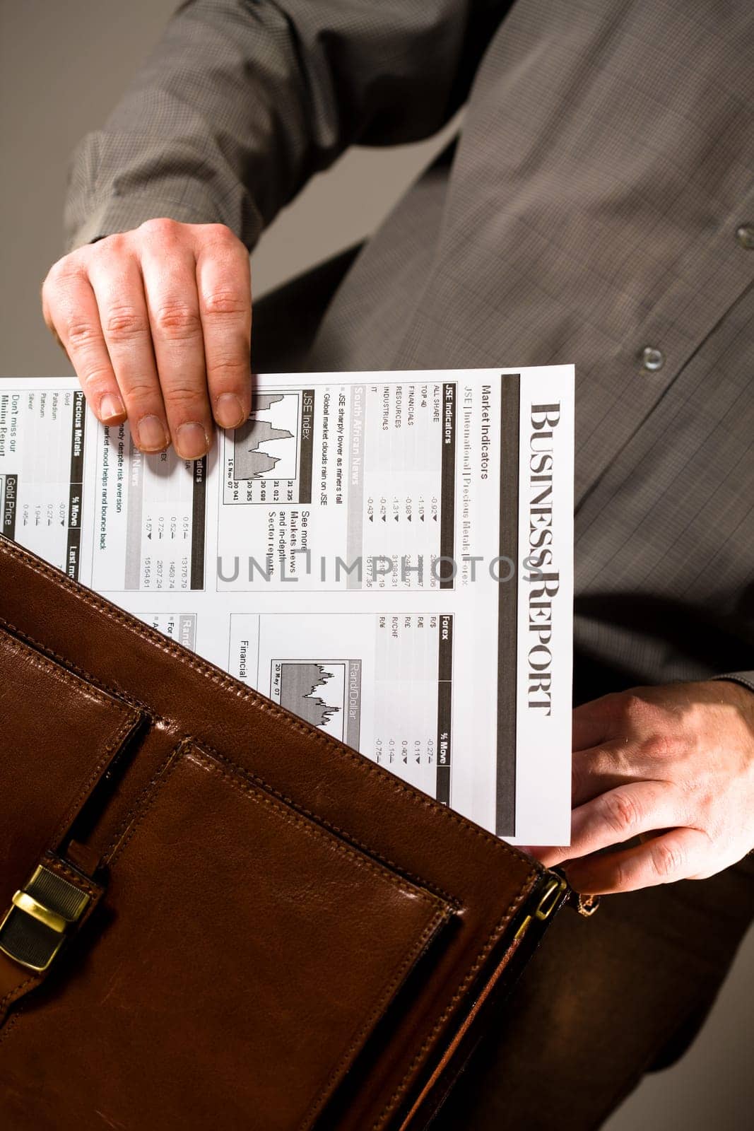 Businessman holding business report