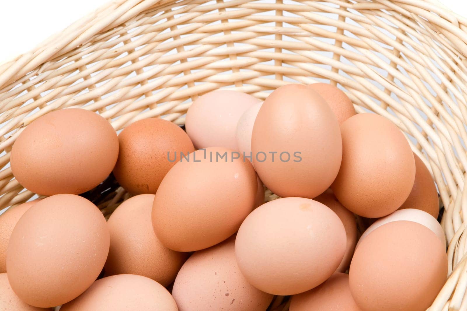 Basket with a lot of hen eggs