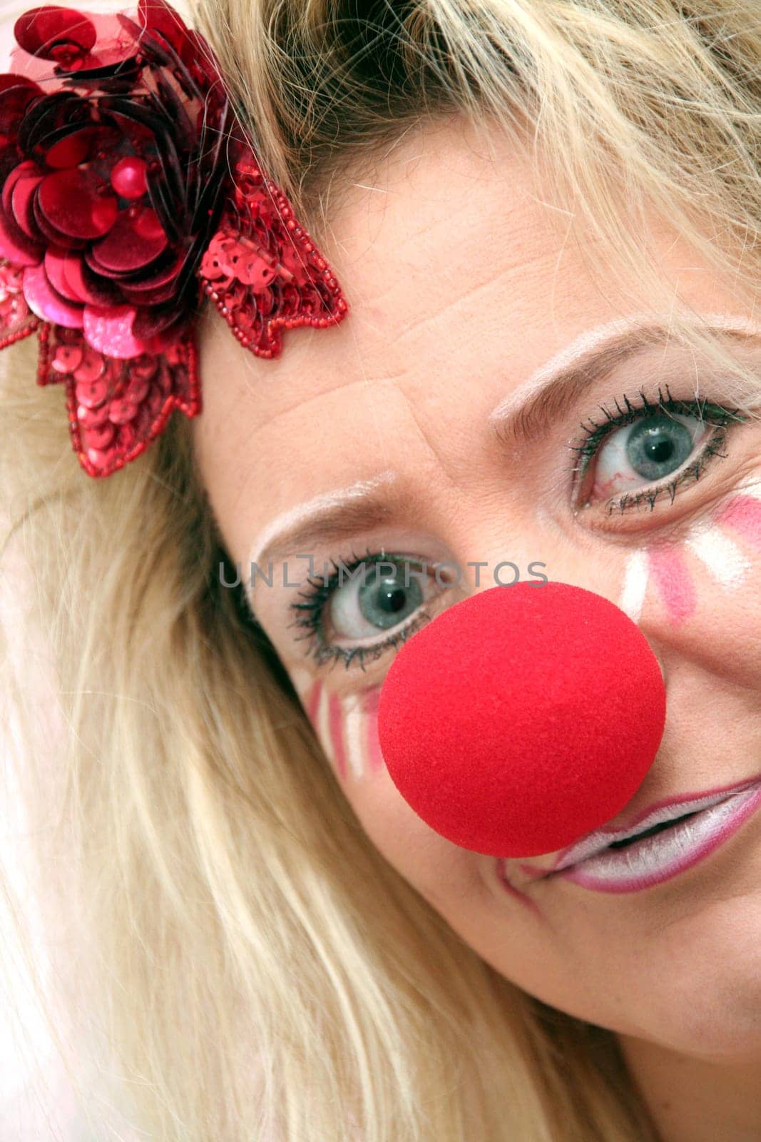 costumed woman with red nose