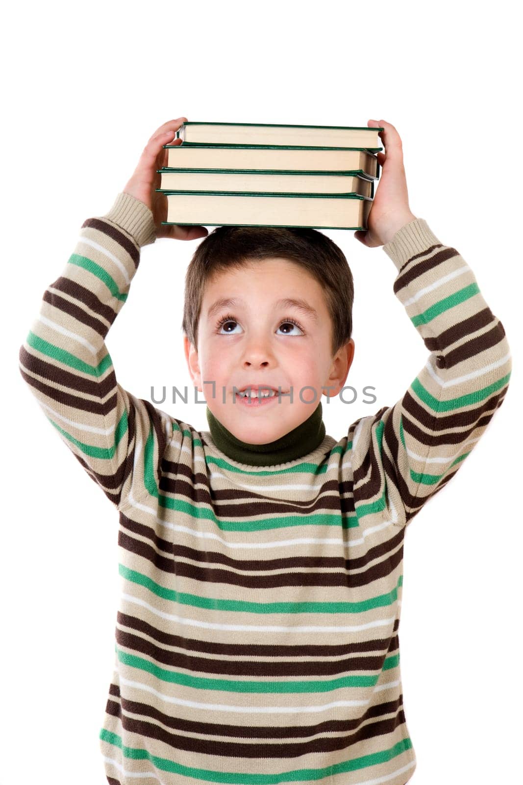 Adorable child studying with books