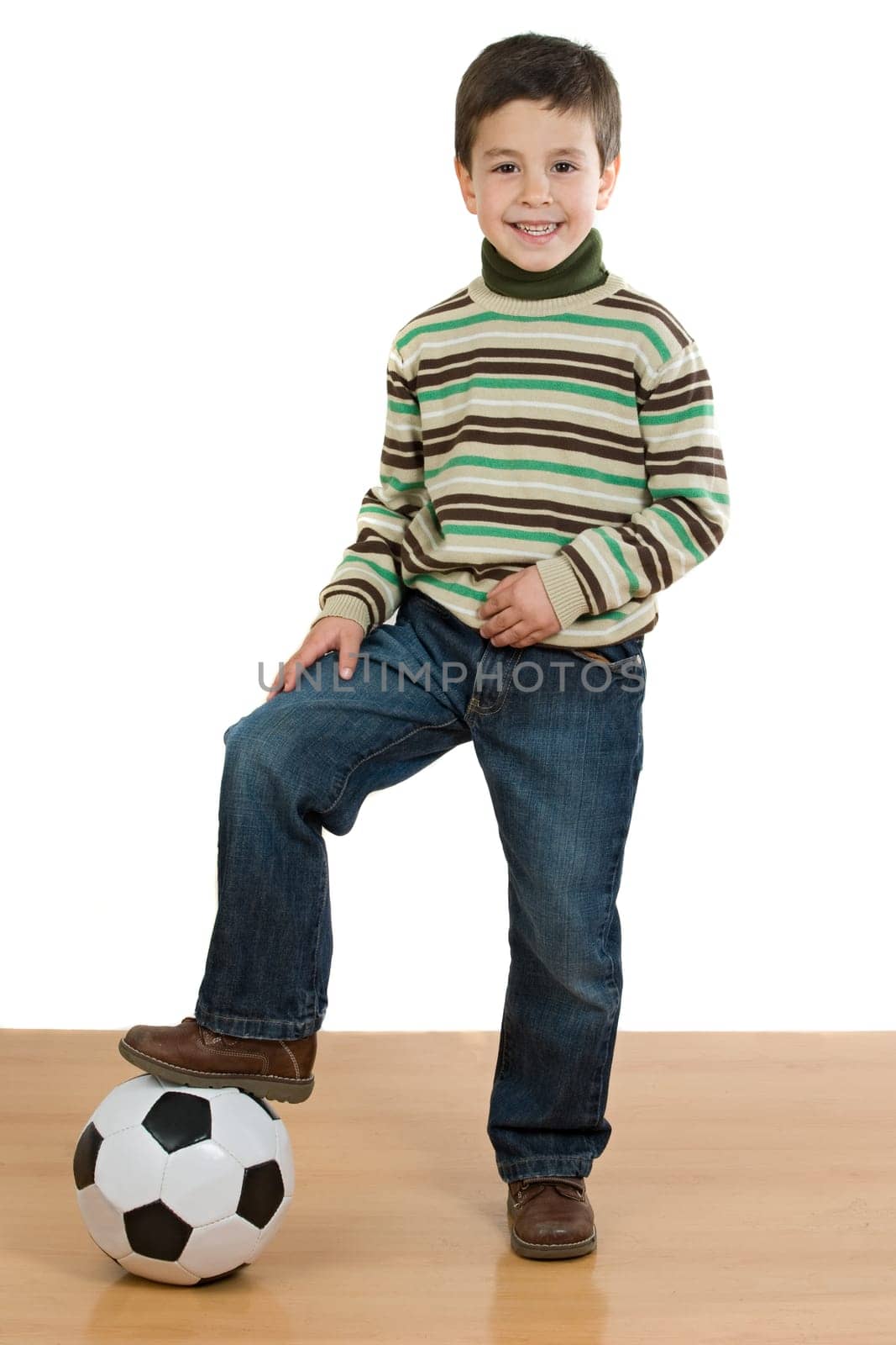 Adorable player boy with soccer ball