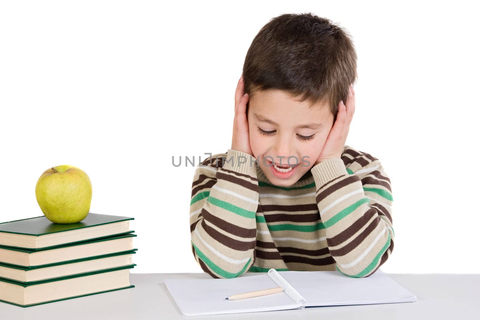 Adorable child studying with books