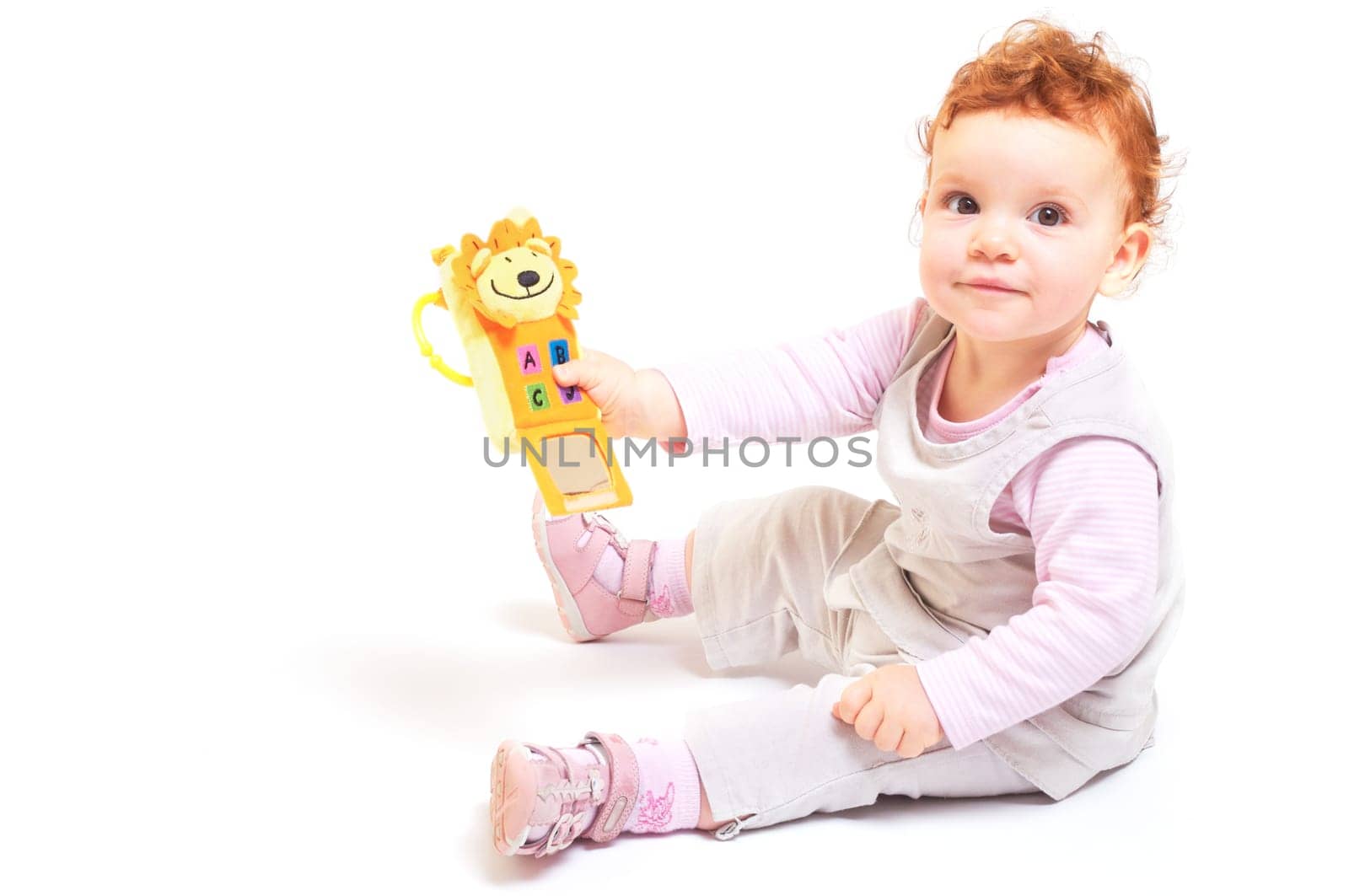 Redhead baby playing