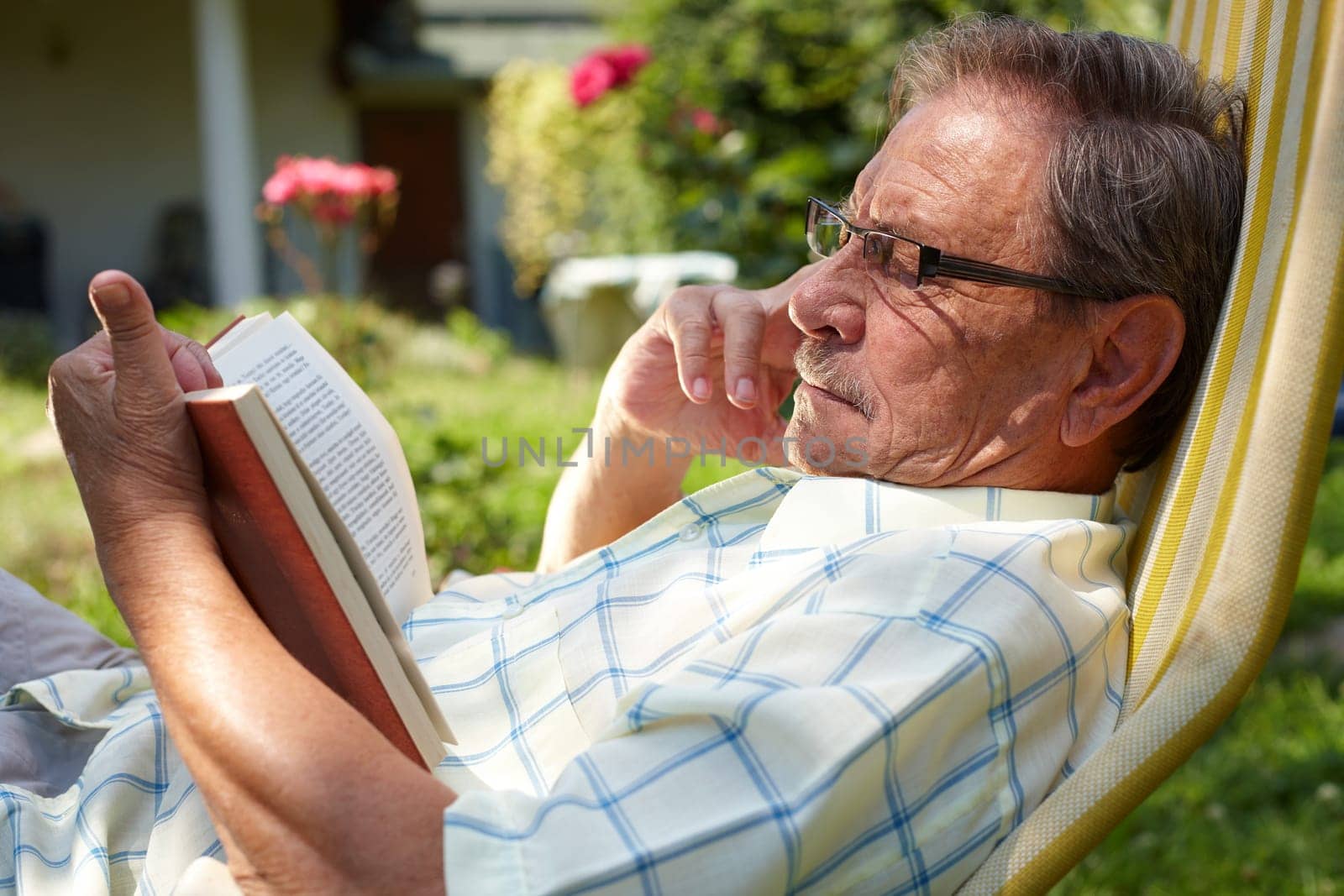 Senior man reading outdoor