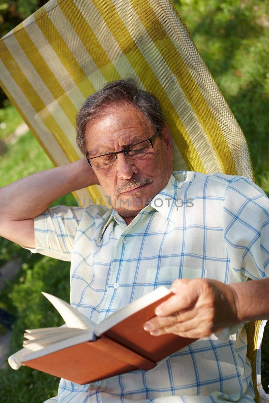 Senior man reading outdoor