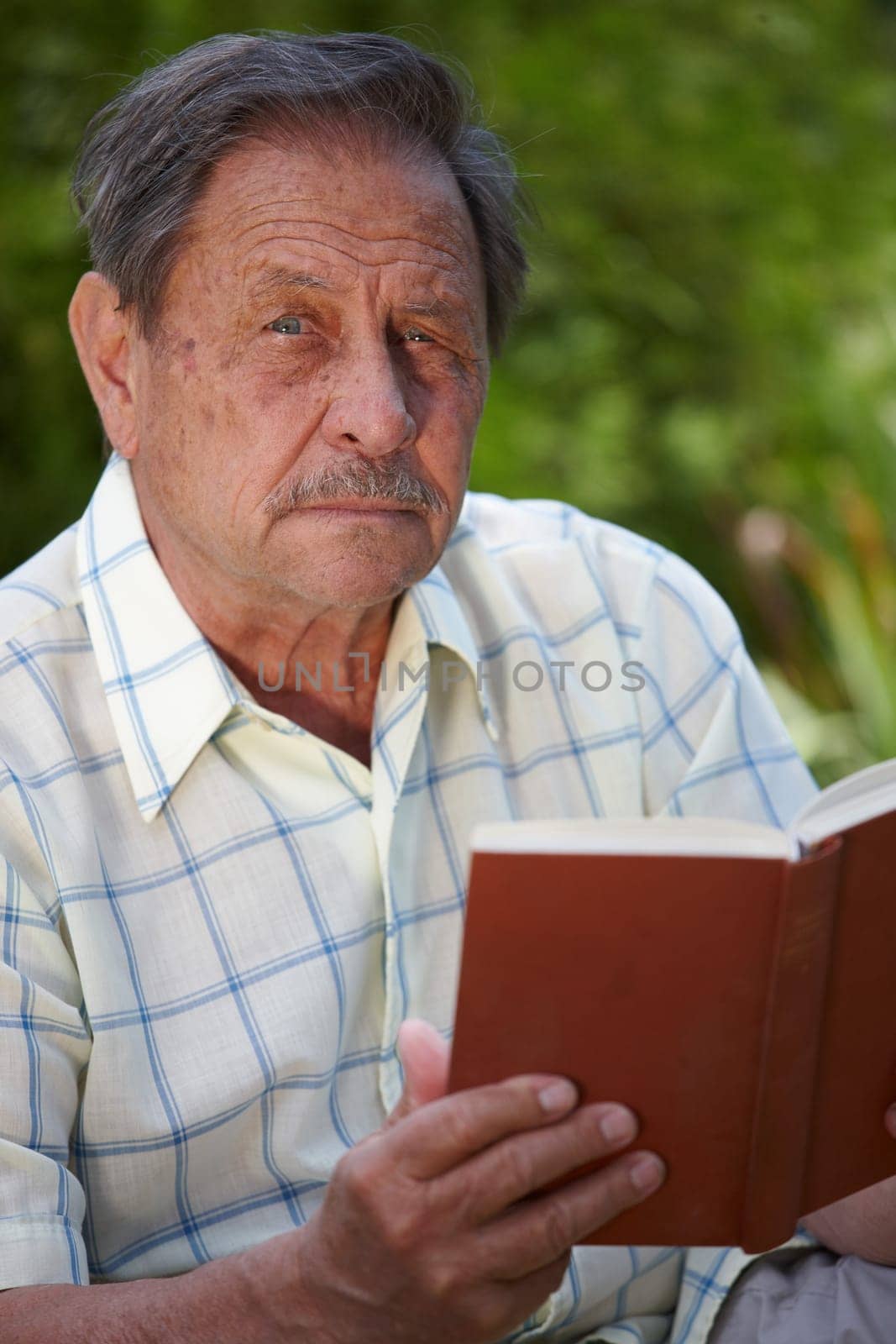 Senior man reading book