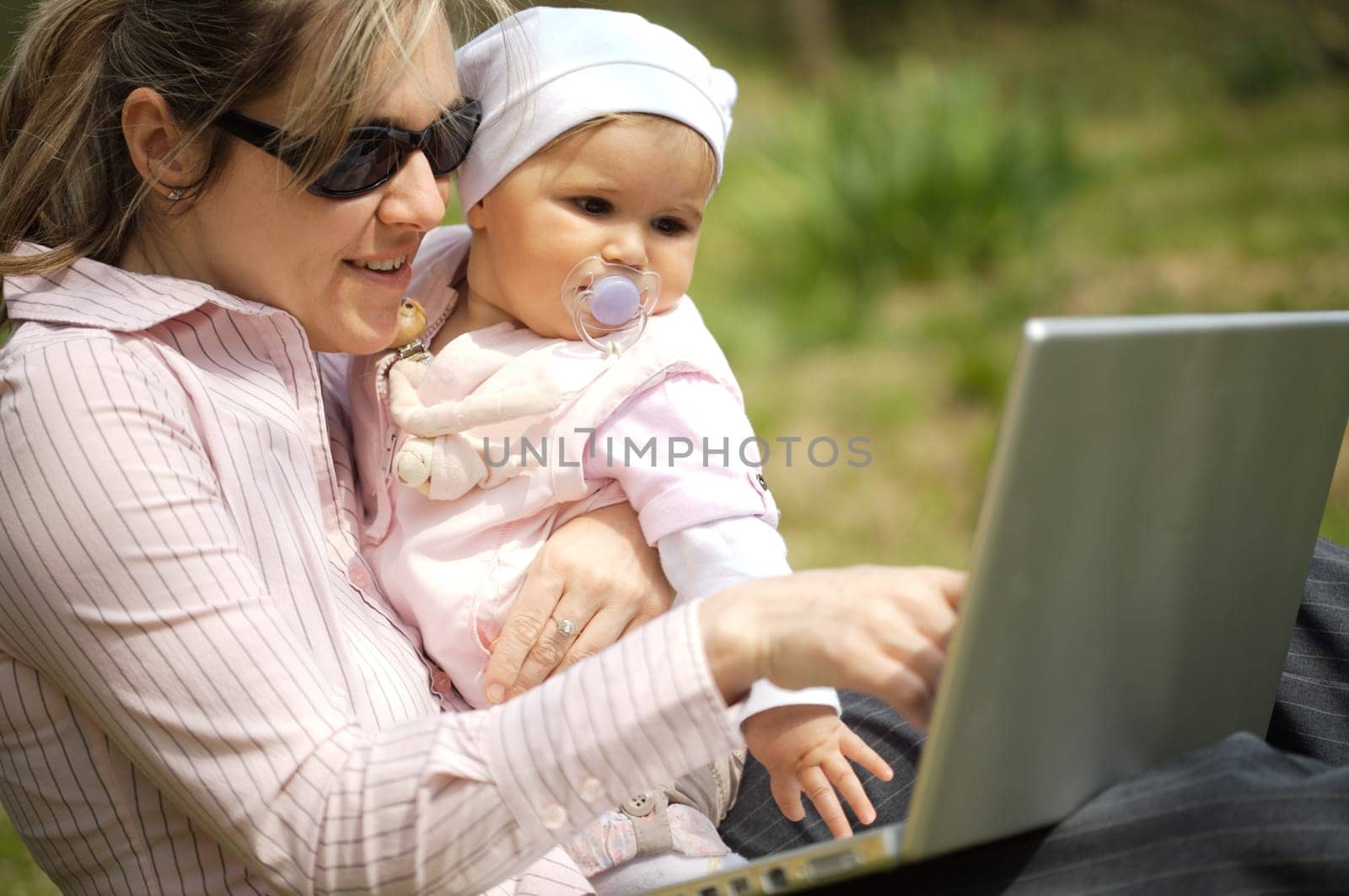 Mother uses a laptop