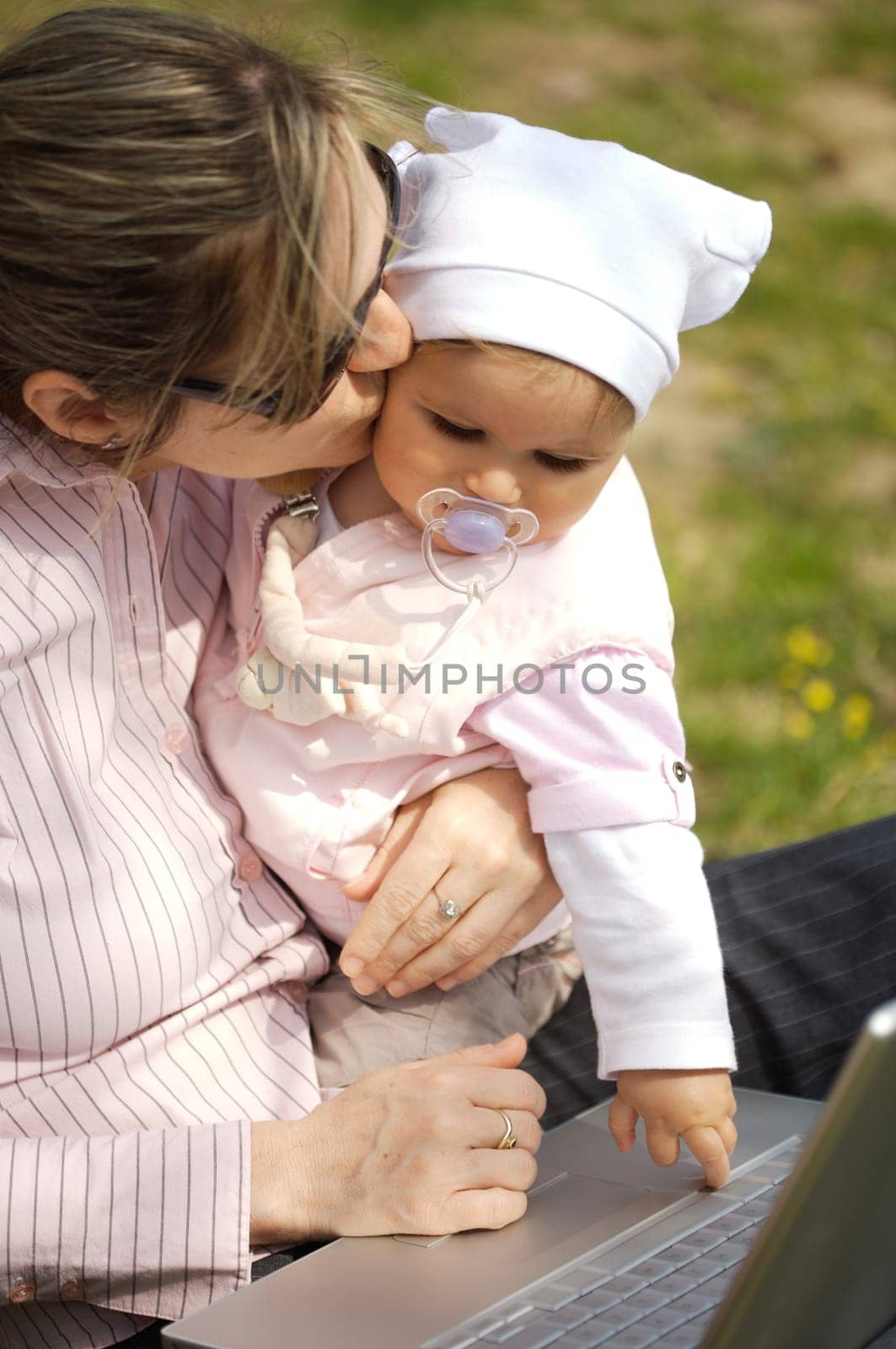 Mother uses a laptop