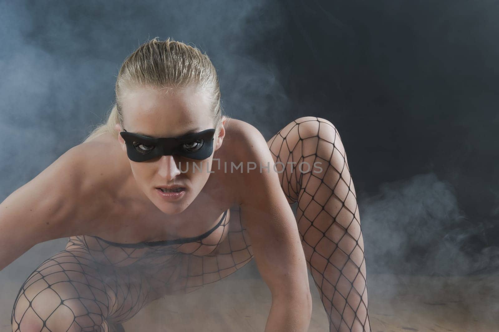 Sexy girl in smoke filled room