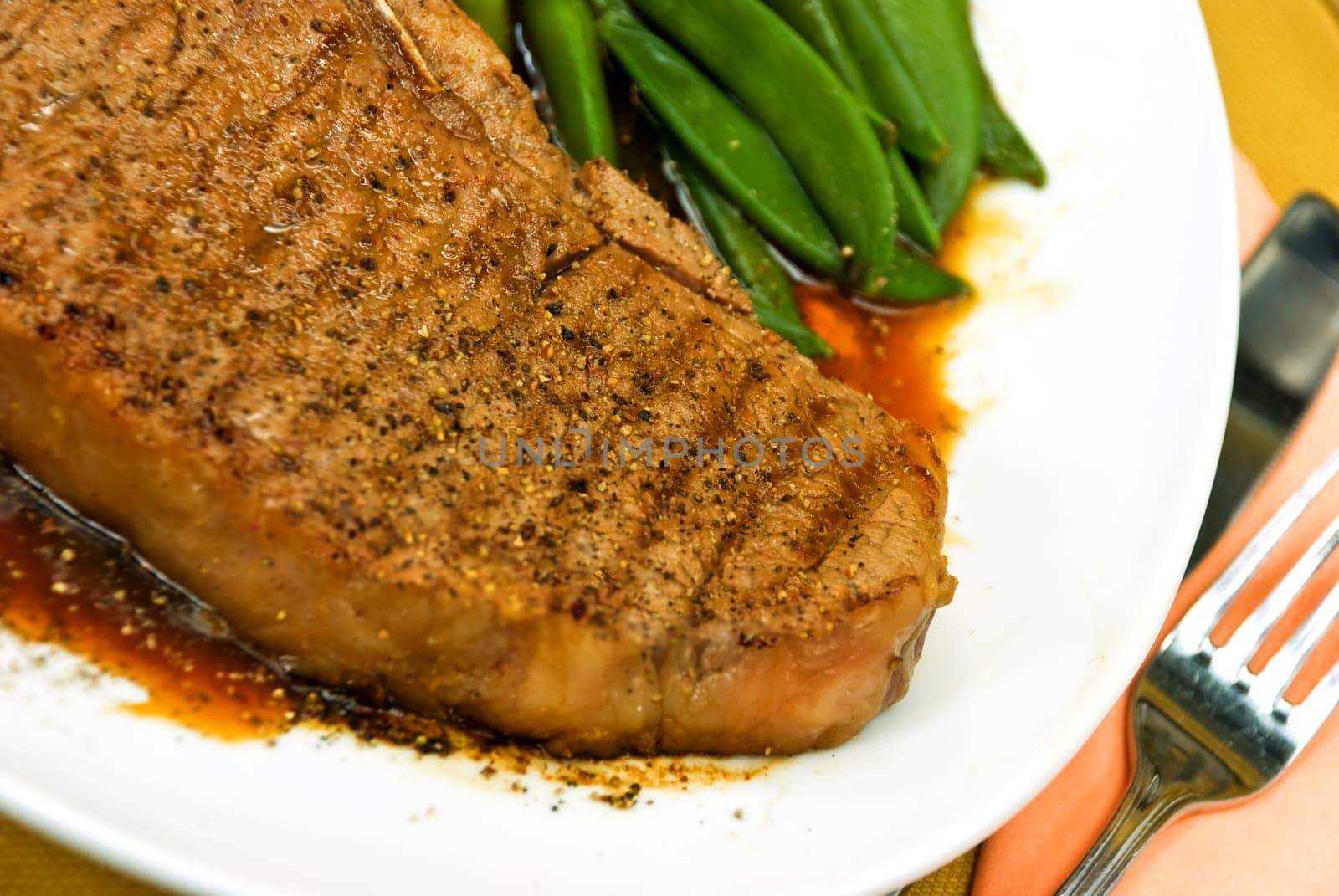 T-bone steak with potatoes,large beans