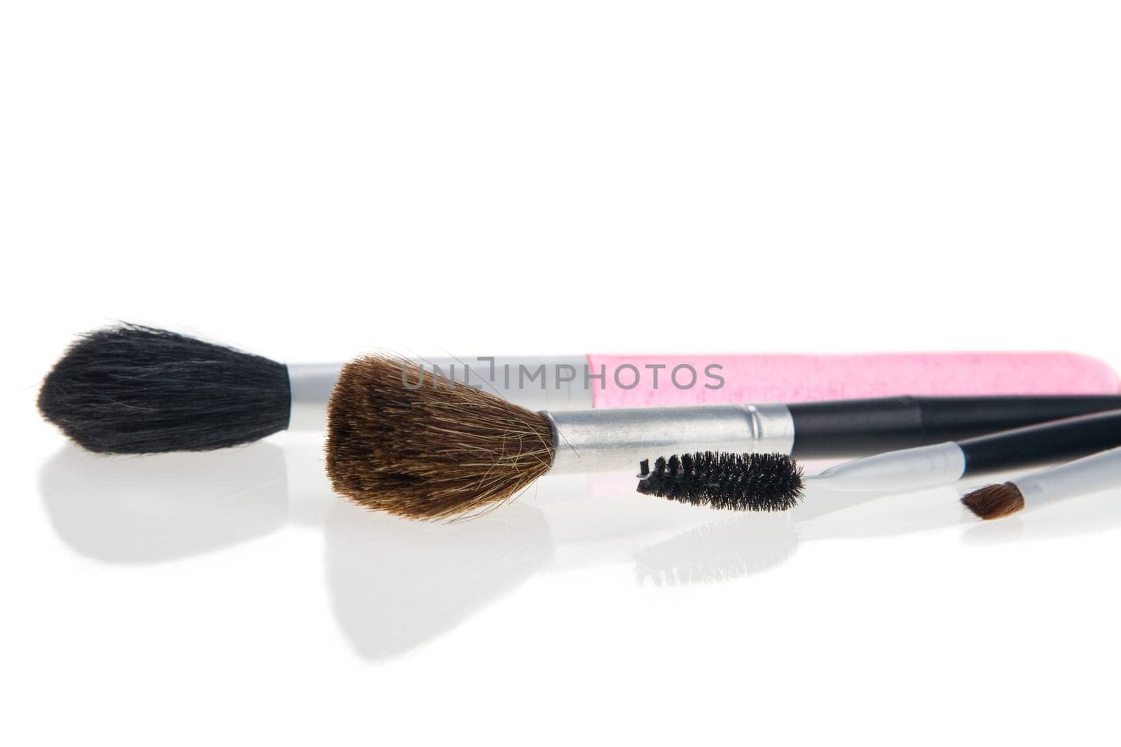 Makeup brushes on white background