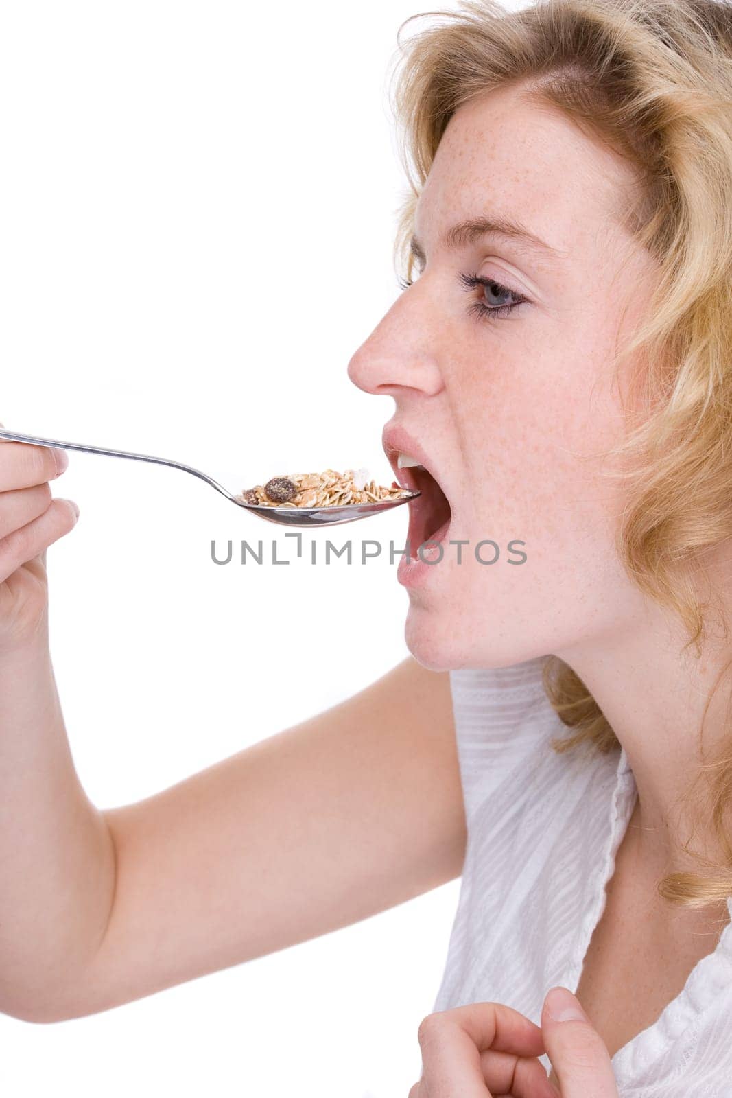 Young woman eating cereal