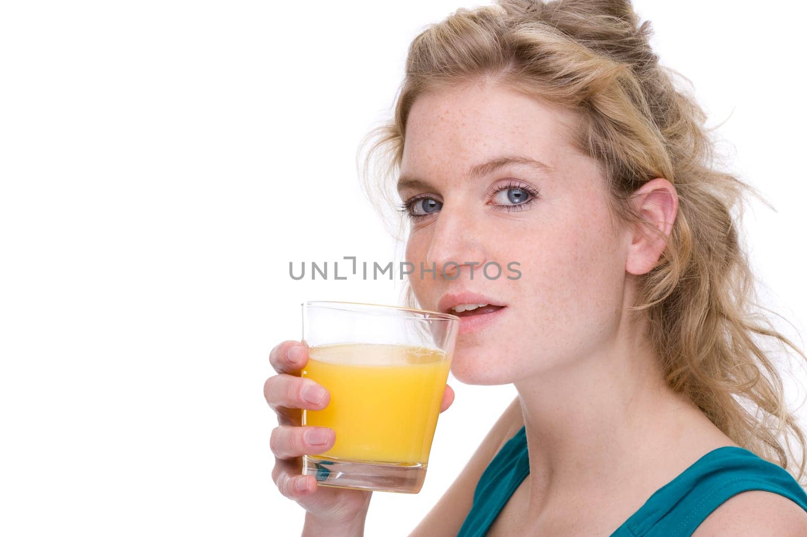 Young woman with glass of orange juice