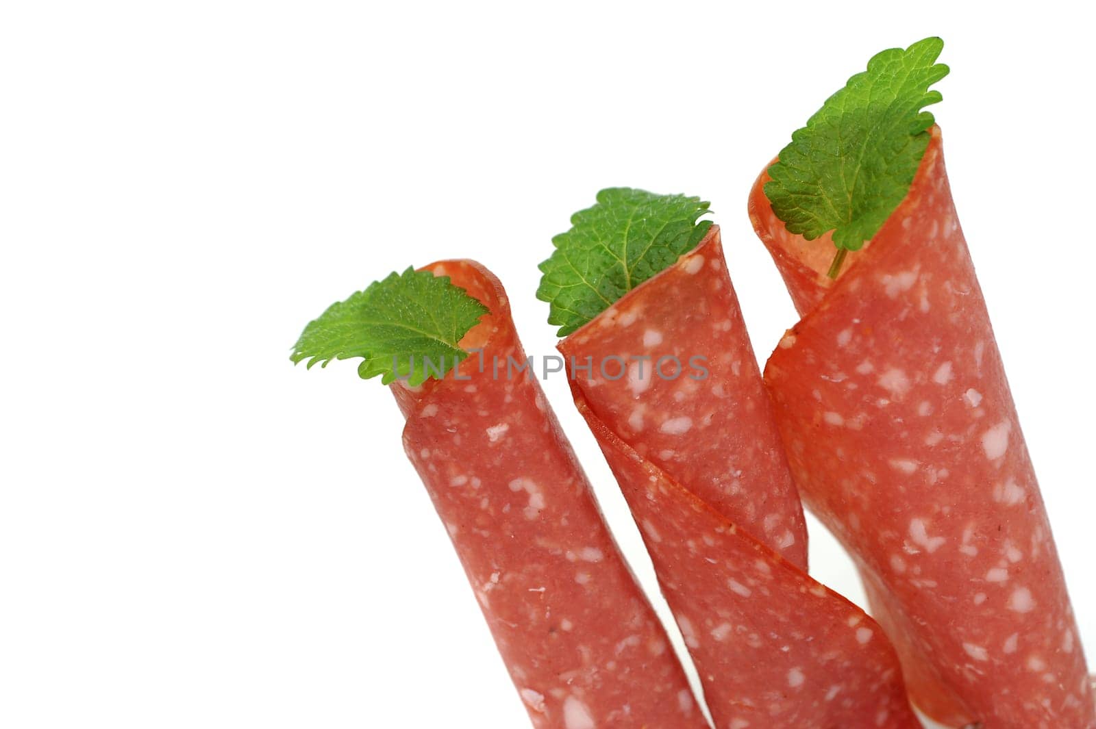 Three slices of salami standing
