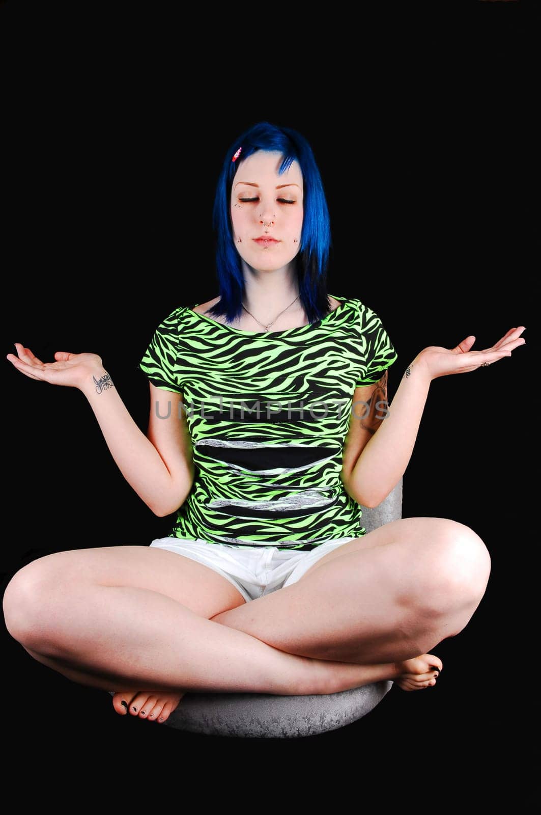 Blue hair girl meditating.