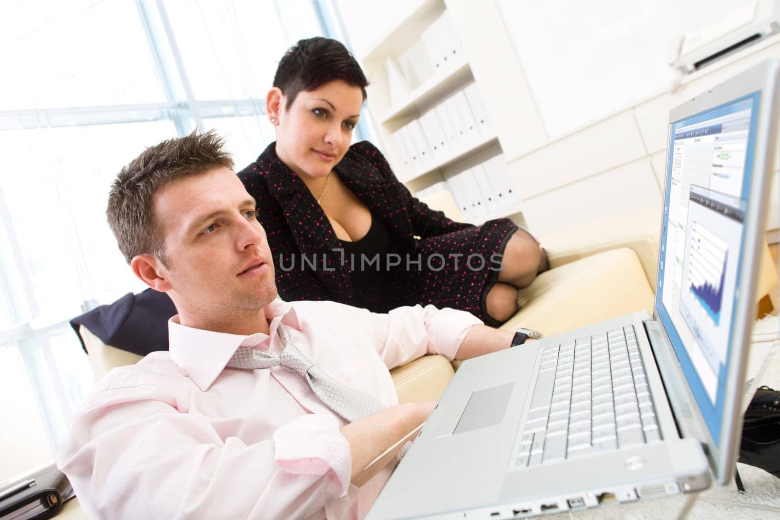 Businesspeople working on computer