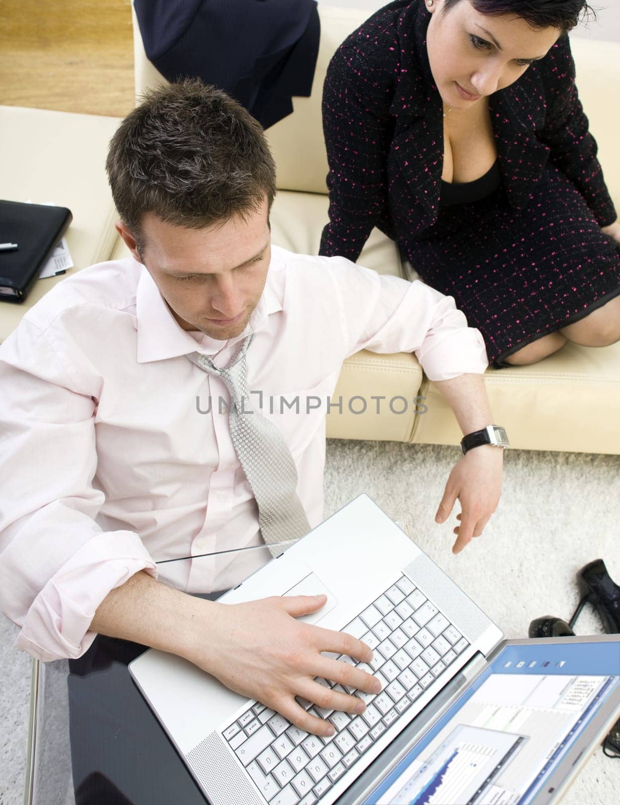 Businesspeople working on laptop