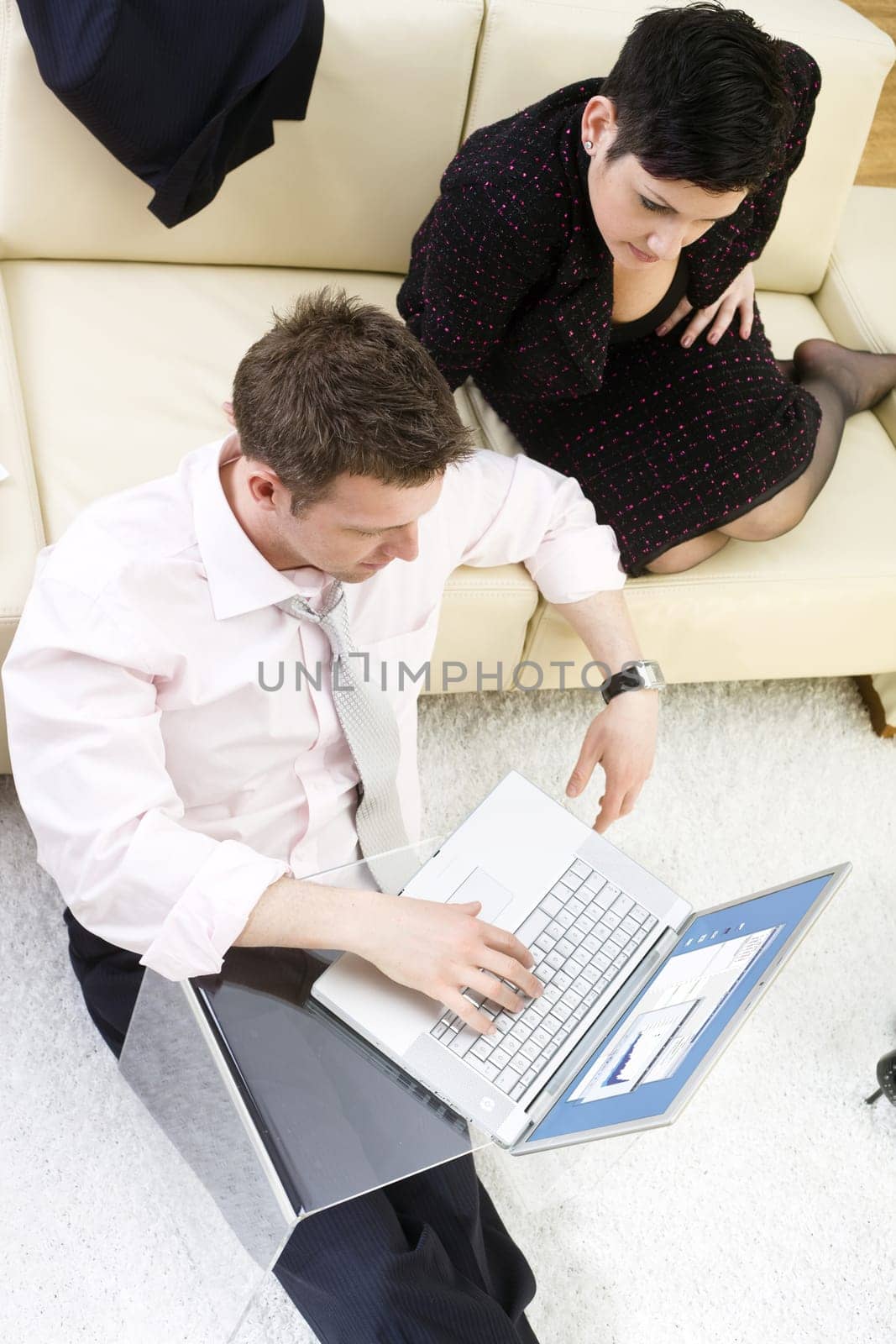 Businesspeople working on laptop