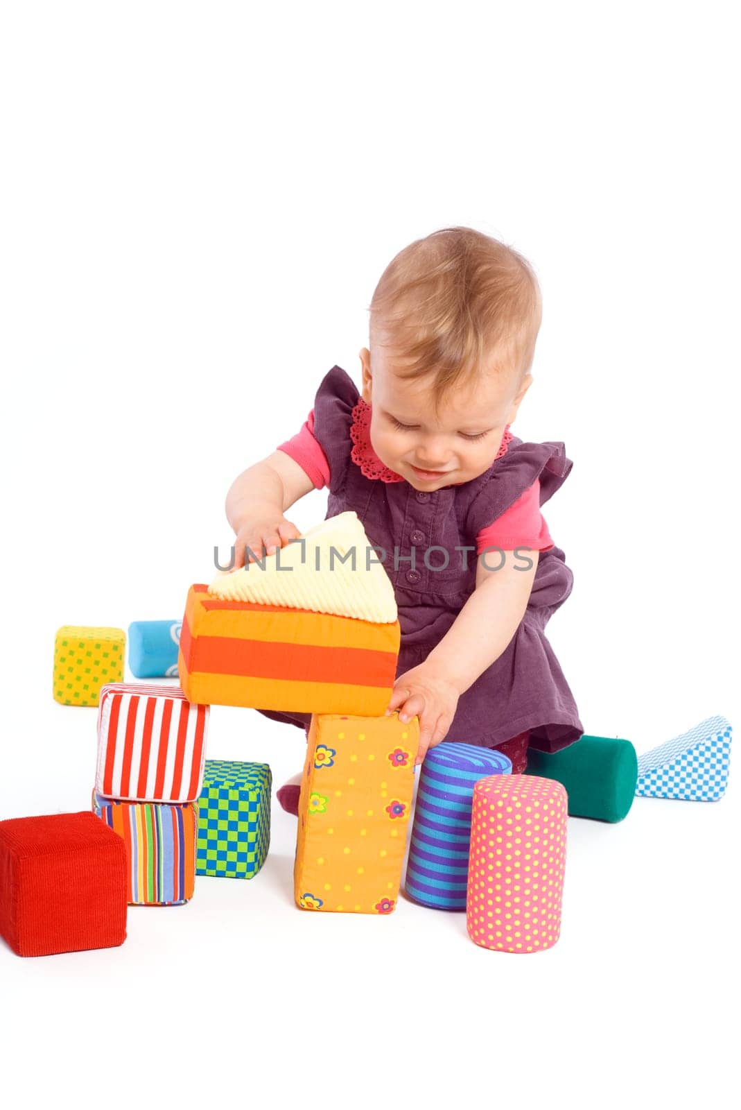 Baby playing with toy blocks