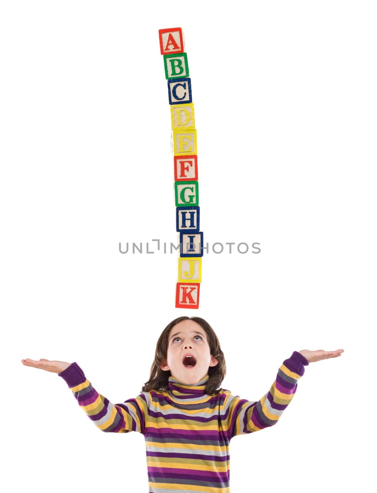 Little girl doing some balance with wood