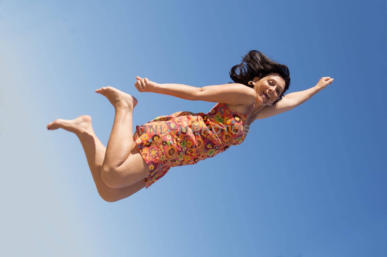 Beautiful girl flying