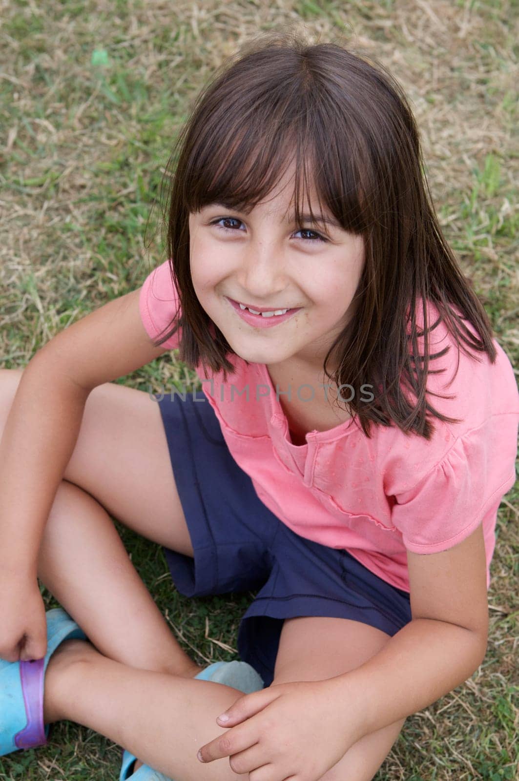 Beautiful little girl sitting