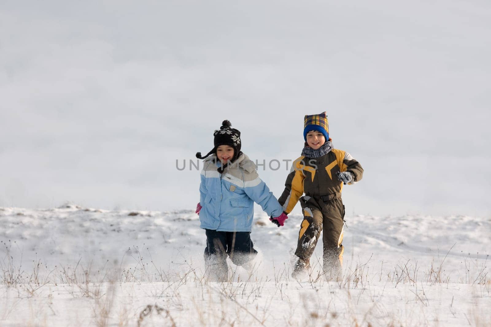 Little girl and boy running