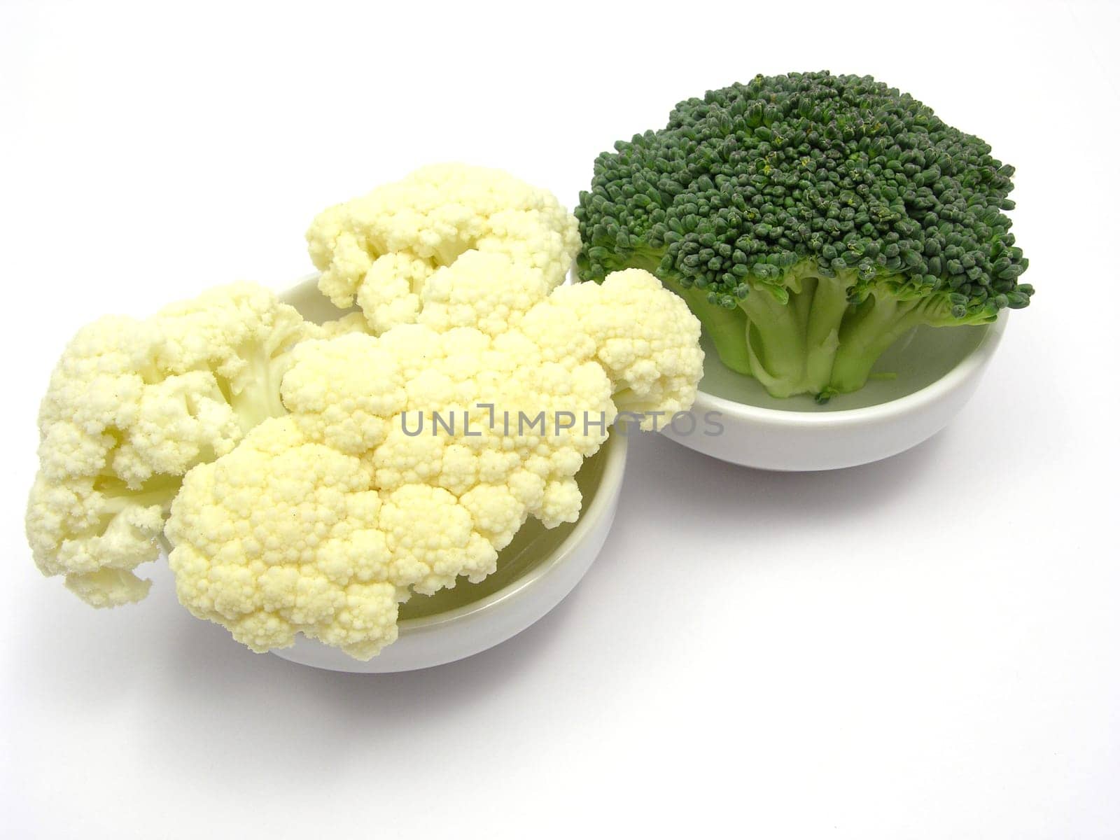 Cauliflower and broccoli in small bowls