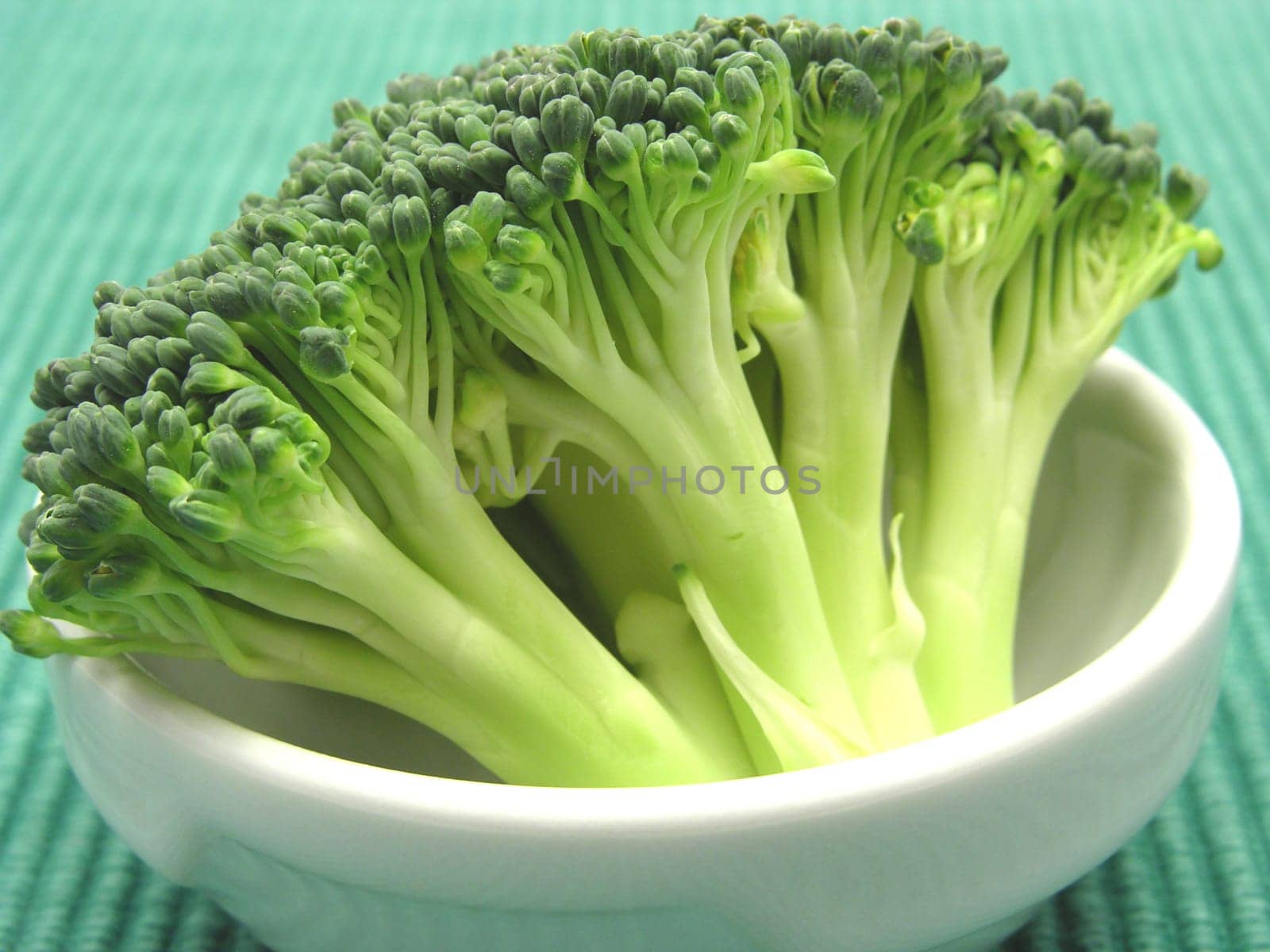 Broccoli in a small porcelain bowl