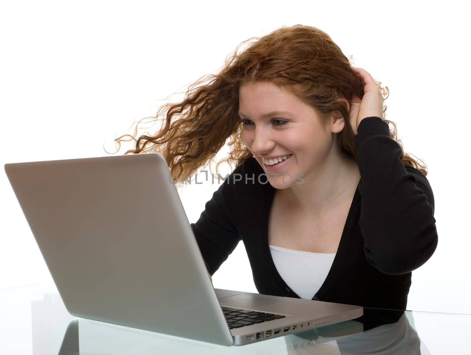 redhead teen with laptop