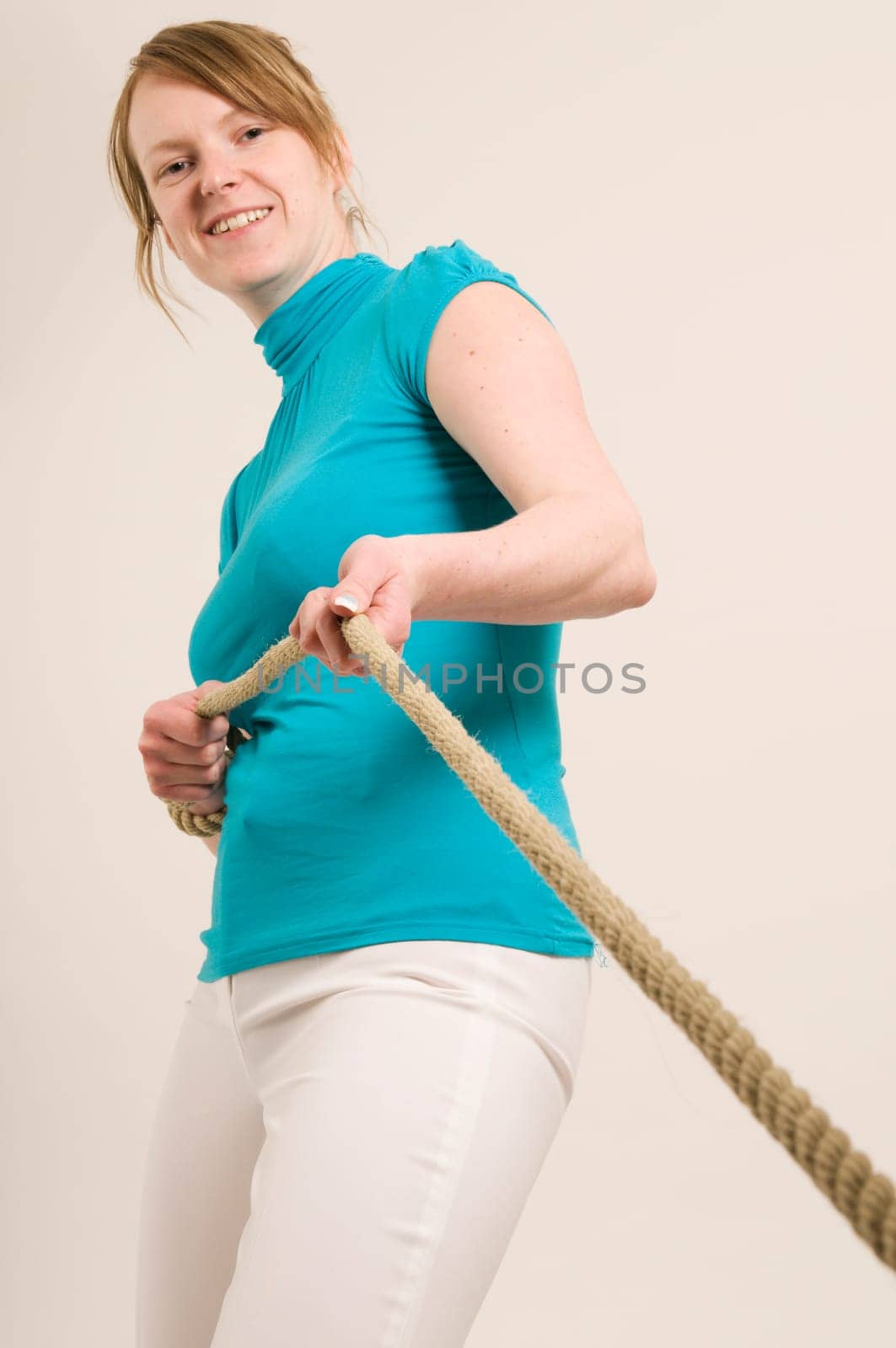 woman draw to the rope
