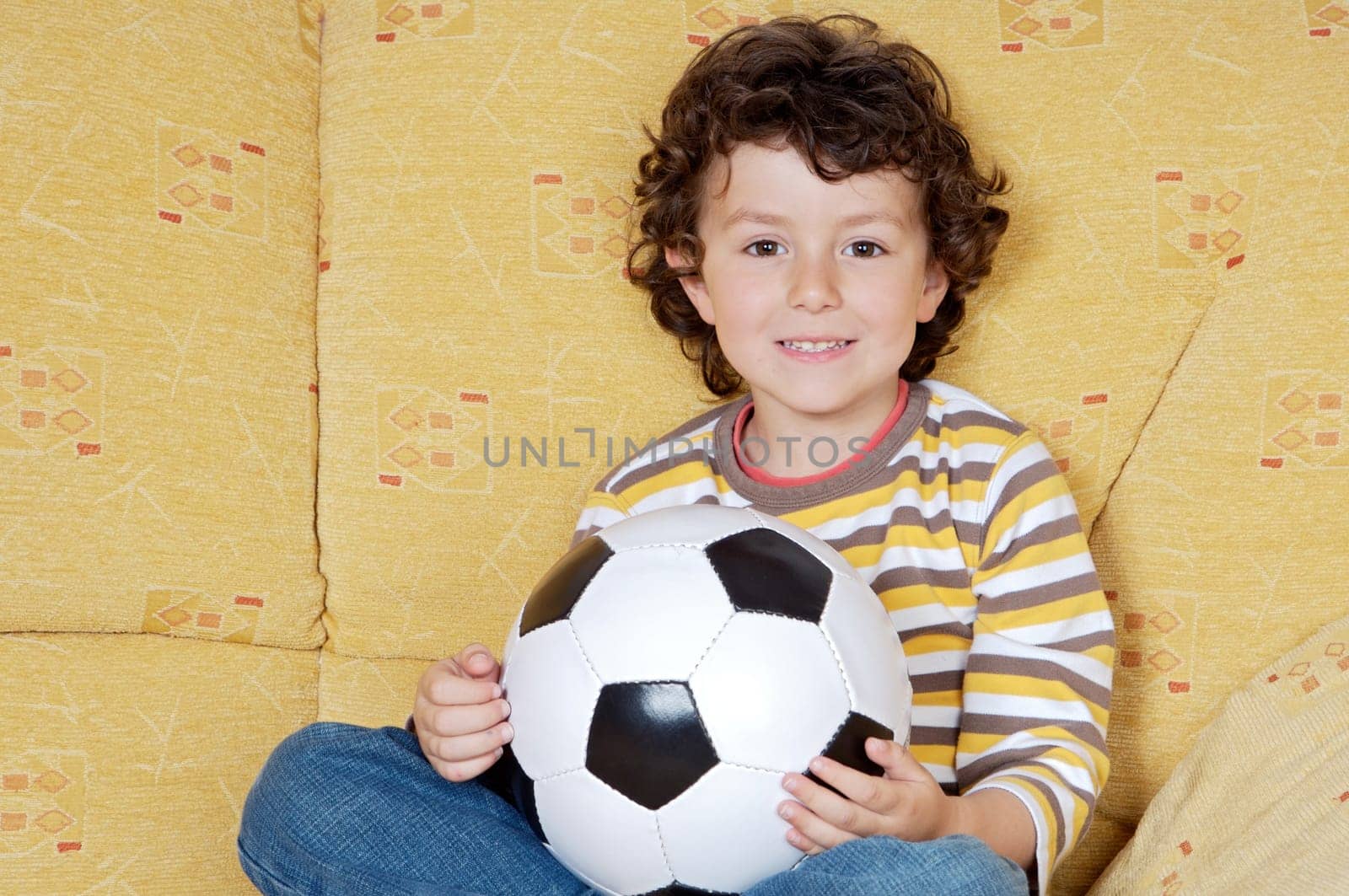 Adorable boy with a ball