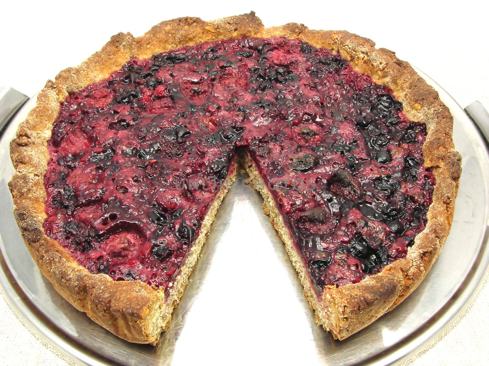 Sliced berry cake on cake tray