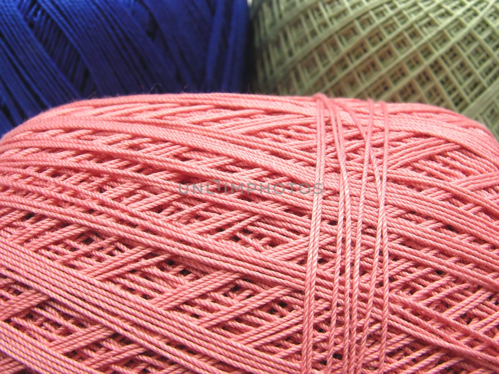 Wool balls in blue,green and pink as a close-up