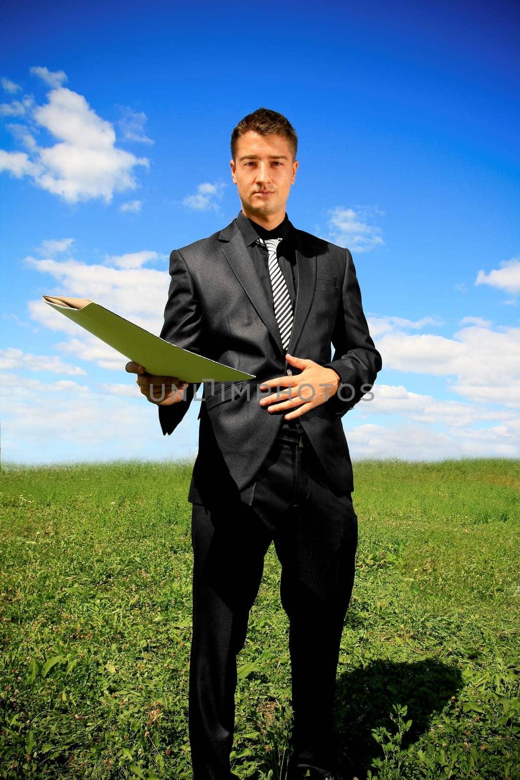 Businessman offering a folder